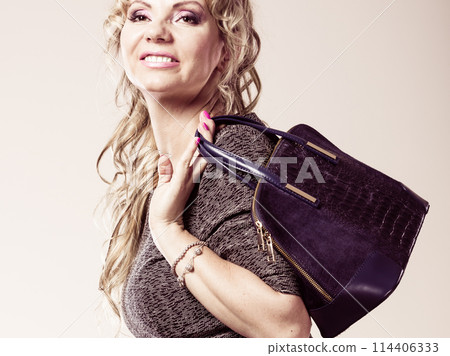 Mature lady with handbag. Mature lady with handbag. 114406333