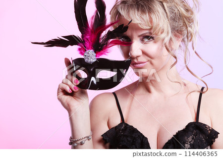 Woman middle aged holds carnival mask. Woman middle aged holds carnival mask. 114406365