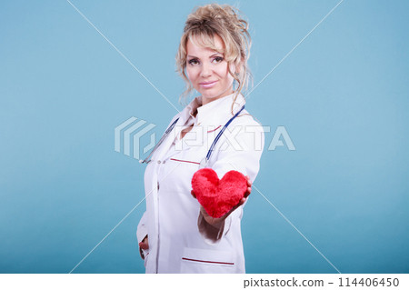 Middle aged blonde doctor enjoy her work. Middle aged blonde doctor enjoy her work. 114406450