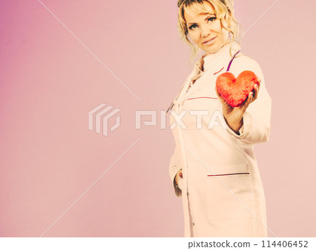 Middle aged blonde doctor enjoy her work. Middle aged blonde doctor enjoy her work. 114406452