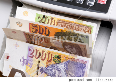 Macedonian denar in a counting machine Macedonian denar in a counting machine 114406538
