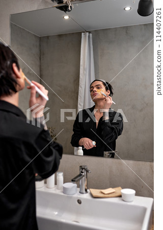 Handsome bisexual getting a facial treatment. Beauty Skin care concept Handsome bisexual getting a facial treatment. Beauty Skin care concept 114407261