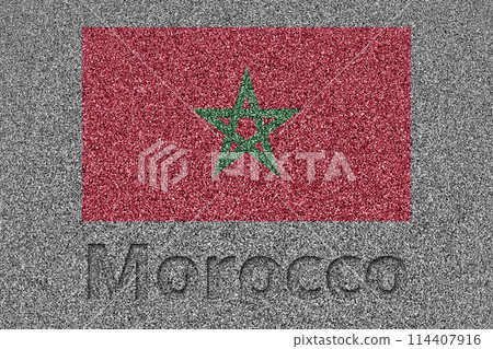 The Moroccan flag painted on a stone slab with the word "Morocco" carved into it 114407916