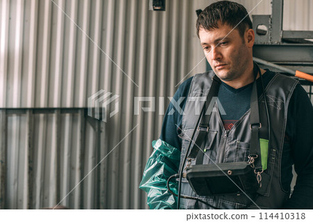 veterinarian, equipped with an ultrasound device, stands guard over the health of the herd, demonstrating a blend of care and advanced technology veterinarian, equipped with an ultrasound device, stands guard over the health of the herd, demonstrating a blend of care and advanced technology 114410318
