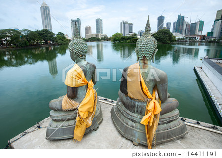Bronze Buddha statues situated at Seema Malaka buddhist temple on Beira Lake in Colombo, Sri Lanka. Colombo is the commercial capital and largest city of Sri Lanka. Bronze Buddha statues situated at Seema Malaka buddhist temple on Beira Lake in Colombo, Sri Lanka. Colombo is the commercial capital and largest city of Sri Lanka. 114411191