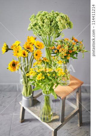 a bunch of yellow and white flowers are sitting on a table a bunch of yellow and white flowers are sitting on a table 114411214