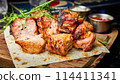 Pork shish kebab on pita bread with two types of sauces 114411341