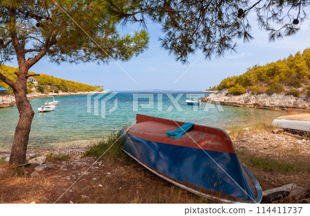Boats on a Beach in a Tranquil Lagoon, Hvar Island, Croatia 114411737