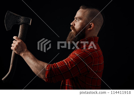 lumberjack. Confident bearded man attached to forehead axe 114411918