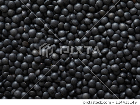 Black organic raw lentils grain seeds textured background. Black organic raw lentils grain seeds textured background. 114413149