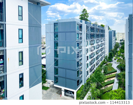 Condominium building with a blue sky Condominium building with a blue sky 114413313