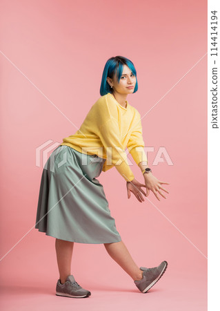 creative girl trying to show any item to her friends as they are playing a game creative girl trying to show any item to her friends as they are playing a game 114414194