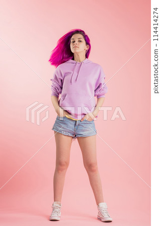 awesome girl in trendy clothes with blowing purple hair awesome girl in trendy clothes with blowing purple hair 114414274