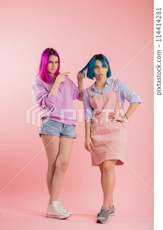 attractive girl with violet hair abusing her friend attractive girl with violet hair abusing her friend 114414281