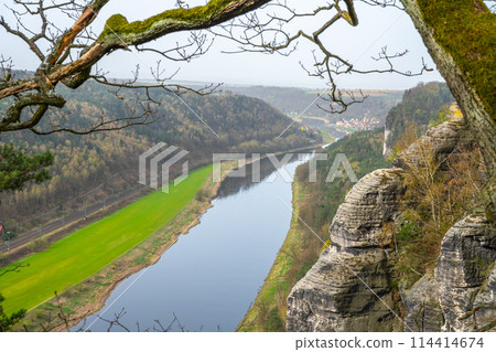 Overlooking the serpentine Elbe River as it carves through Saxon Switzerland National Park from the Bastei cliffs during springtime. Germany Overlooking the serpentine Elbe River as it carves through Saxon Switzerland National Park from the Bastei cliffs during springtime. Germany 114414674