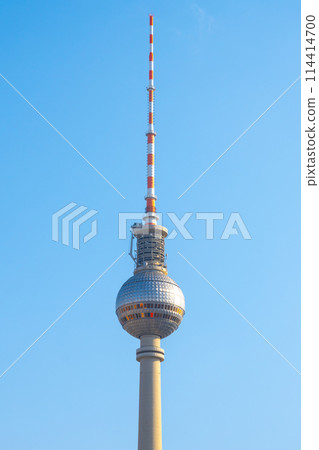 The Berlin TV Tower stands tall, its sphere and antenna reaching into a clear blue sky. Berlin, Germany The Berlin TV Tower stands tall, its sphere and antenna reaching into a clear blue sky. Berlin, Germany 114414700