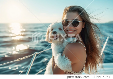 Woman with dog on yacht 114415067