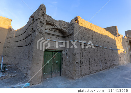 Ancient earthen buildings in the old town of Yazd, Iran. 114415956