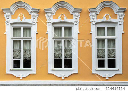 retro style windows on the facade of the building retro style windows on the facade of the building 114416134