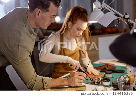 young people are good at creating leather goods young people are good at creating leather goods 114416356