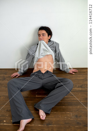 nervous scared man with sweater on his mouth nervous scared man with sweater on his mouth 114416712
