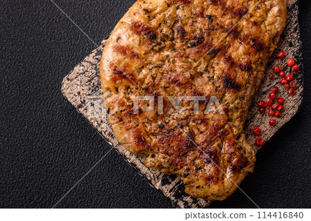 Delicious juicy pork steak with salt, spices and herbs Delicious juicy pork steak with salt, spices and herbs 114416840