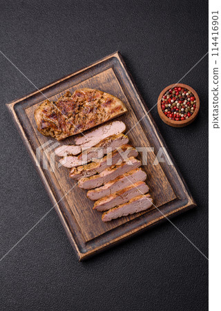 Delicious juicy pork steak with salt, spices and herbs Delicious juicy pork steak with salt, spices and herbs 114416901