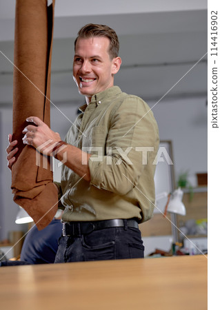 happy excited smiling man has bought genuine leather 114416902