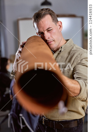 professional crafter checking the material professional crafter checking the material 114416933