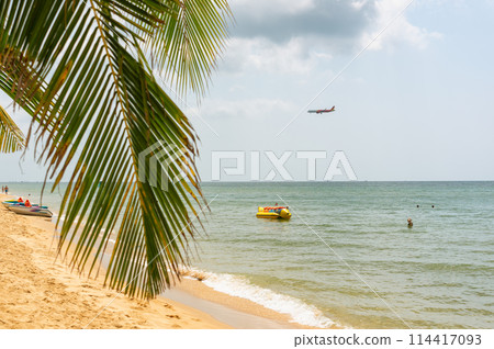 Phu Quoc Island, Vietnam, February 4, 2024 A Vietjet airline plane is landing over the beach of Phu Quoc Island 114417093