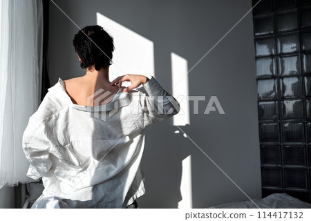 sexy young glamour man in stylish white shirt scratching his neck, shoulder sexy young glamour man in stylish white shirt scratching his neck, shoulder 114417132