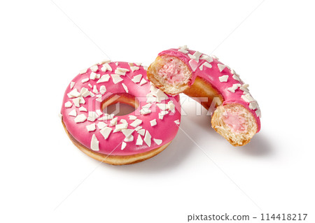 Donuts with creamy berry filling, pink icing and chocolate chips 114418217