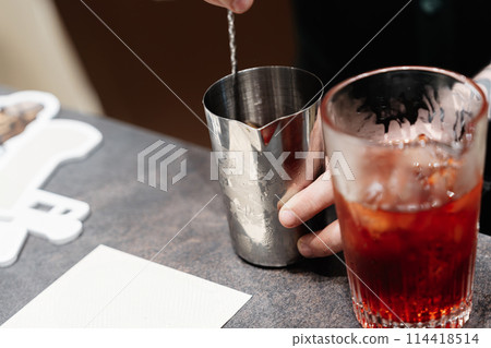 Preparation of a delicious cocktail at the bar. 114418514