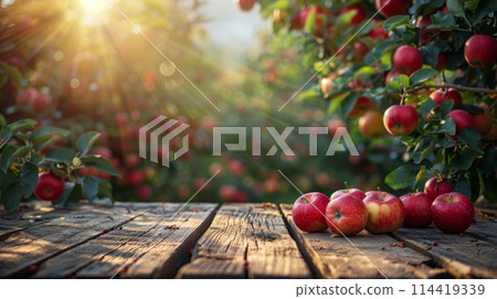 Wooden Table Covered With Red Apples 114419339