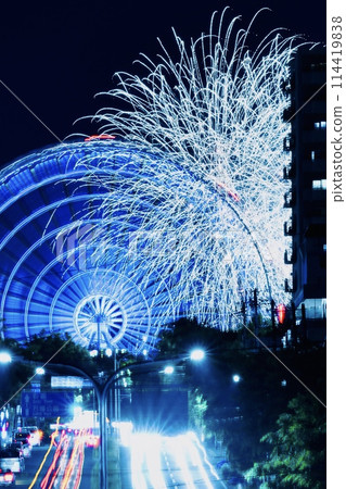 Large fireworks and laser beams entangled in a Ferris wheel Large fireworks and laser beams entangled in a Ferris wheel 114419838