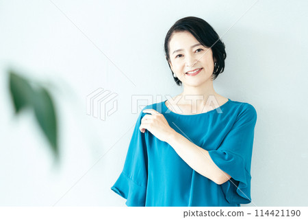 A woman smiling at the camera A woman smiling at the camera 114421190