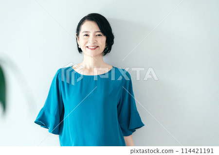 A woman smiling at the camera A woman smiling at the camera 114421191