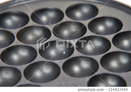 Zoom of the Takoyaki machine Zoom of the Takoyaki machine 114422485