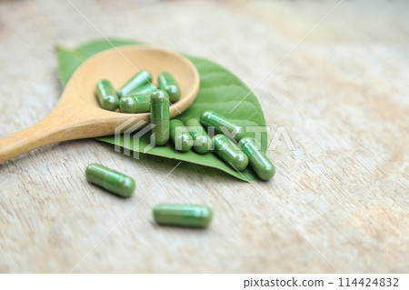 Green herbal capsules from herb for healthy eating in daily life 114424832