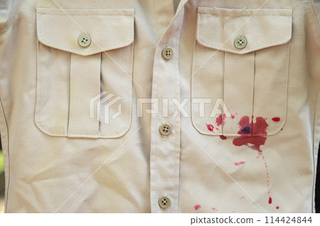 dirty red sweet drink stain on shirt from drinking in dirty stain for cleaning concept 114424844