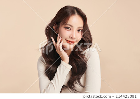 Beautiful young asian woman with clean fresh skin on beige background, Face care, Facial treatment, Cosmetology, beauty and spa, Asian women portrait. 114425091