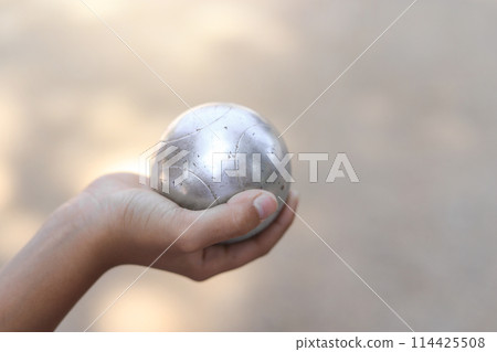 Kid hand hold metal ball in playing sport in free time for learning Kid hand hold metal ball in playing sport in free time for learning 114425508