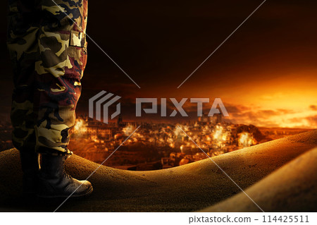 An Image of a city in the desert under attack with explotion and smokes at night. An Image of a city in the desert under attack with explotion and smokes at night. 114425511