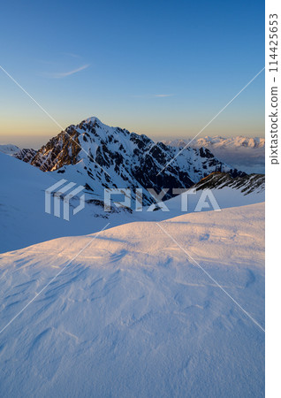 Mt. Tsurugi illuminated by the setting sun Mt. Tsurugi illuminated by the setting sun 114425653