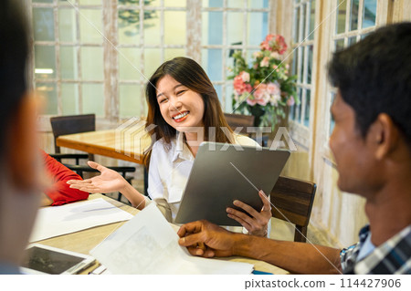 Happy diversity business people smile during a planning, coaching, brainstorming for project meeting in a startup company. 114427906
