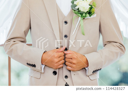 Groom dressing scene Groom dressing scene 114428327
