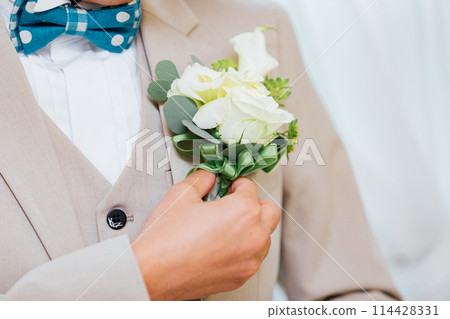 Groom dressing scene Groom dressing scene 114428331