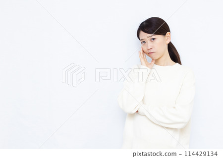 A woman who is seriously worried 114429134