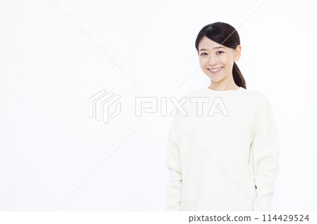 A woman in a white sweater A woman in a white sweater 114429524