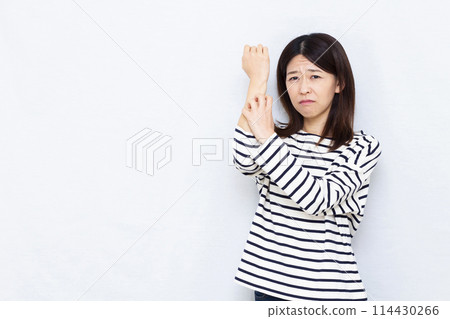 A woman suffering from rough skin A woman suffering from rough skin 114430266